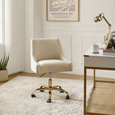 an office with a desk, chair and rug in the corner is shown on the floor