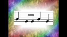 an image of music notes on fire background with rainbow colors in the backround