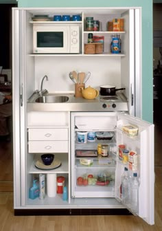 an open refrigerator with its door wide open