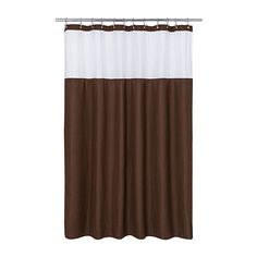 a brown and white shower curtain hanging from a metal rod