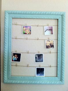 a blue frame with pictures hanging on it