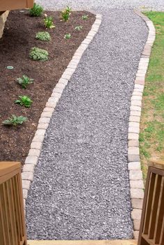 a walkway made out of stones and gravel