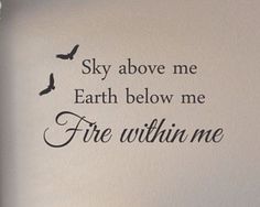 there is a wall decal that says sky above me earth below me fire within me