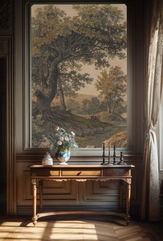 a table with flowers and candles in front of a painting on the wall behind it