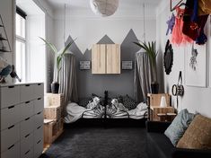 a living room filled with furniture and lots of windows