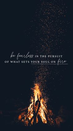 a person standing in front of a fire with the words be fearless in the pursuit of what sets your soul on fire