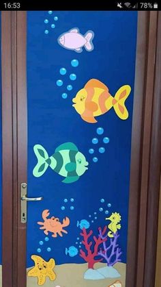 the door is decorated with an ocean theme