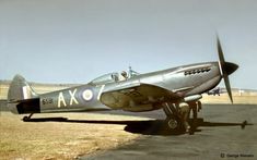 an old airplane is parked on the runway