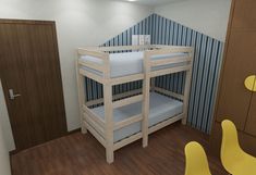 a room with bunk beds and yellow chairs