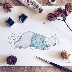 a drawing of a bear wearing a sweater and surrounded by fall leaves, pine cones, and acorns