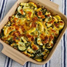 a casserole dish with zucchini and cheese