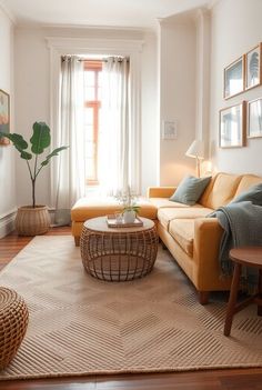 a living room filled with furniture and a rug on top of a hard wood floor