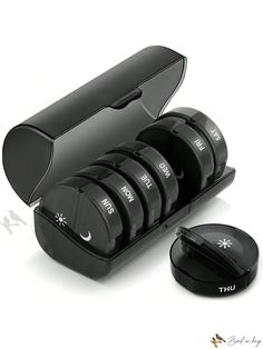 an image of a set of black ear plugs in a case with the lid open