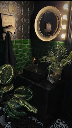 a green tiled bathroom with potted plants in the corner and a mirror on the wall