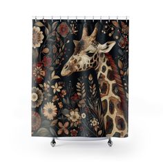 a shower curtain with a giraffe's head and flowers on the side