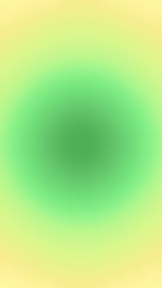 an abstract green and yellow background that is very blurry to the eye level,