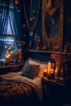 a bedroom with candles on the bed and pictures hanging from the wall in front of the window