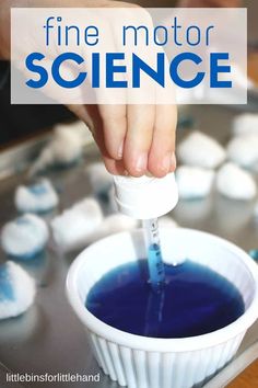 someone is pouring blue liquid into a cup