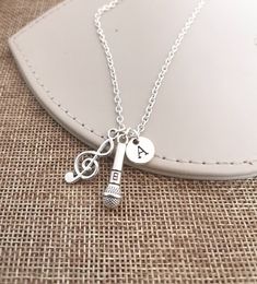 Musical gifts, Music Necklace, Microphone Necklace, DJ Necklace, Microphone Gift, DJ Gift, Music Lover Gift, Gifts for Singers, DJ Jewelry, Microphone  For Similar products :  https://www.etsy.com/uk/shop/YouLoveYouShop?ref=seller-platform-mcnav&search_query=music For Extra initials or customization please message me directly I am happy to help.  All items are silver plated and silver tone jewelry. Photo might be Slightly Different From Actual Item in Terms of Color Due to camera flash and scree Gifts For Singers, Microphone Necklace, Musical Gifts, Gifts For Young Women, Rose Gold Wedding Cakes, Dj Gifts, Music Necklace, Musical Gift, Music Collage