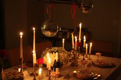 a table with candles and plates on it