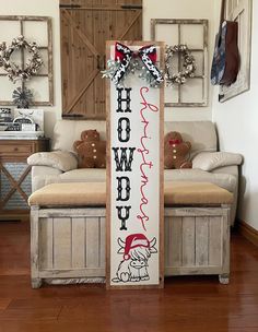 a wooden sign with the words happy holidays on it in front of a living room