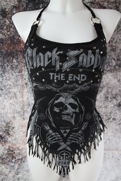 Other design and express delivery available on my website tormentor237.bigcartel.com Black Sabbath halter top Customized from an official T-Shirt Ripped at the bottom Silver rivets all over the front O-ring on the straps Strap to tie behind the neck Size S Flat measurements Bust: 16.5" (42cm) Waist: 15" (38cm) Please note: All sales are final. Check the measurements carefully and make sure you agree to the terms and conditions before each order. Packages are all sent with a tracking number. Do n Black Sabbath Outfit, Alt Tops, Rock Aesthetic Outfits, O Ring Top, Black Sabbath Shirt, Cut Up T Shirt, Punk Clothes, Diy Cut Shirts, Halter Shirt