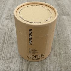 a brown paper container sitting on top of a wooden table