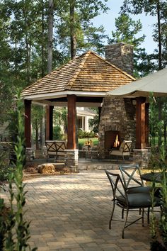 a gazebo with an arrow pointing to the roof and patio furniture in front of it