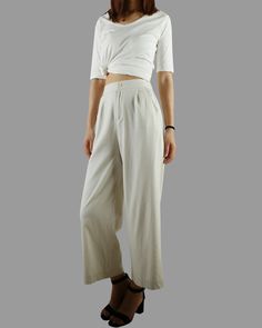 * A wide leg cropped linen pants, with cropped length, two pockets, fixed waist on front and elastic waist on back. * Material: 50% linen, 50% cotton Custom made to fit, lead time is 6-8 days; Let us know your usual size in your country and your overall height. If you have some specific request or special characters such as broad shoulder, long arms, long waist, etc you think we need pay attention to when making, do let me know. * Colors: 1. Beige 2. White 3. Black 4. Khaki 5. Coffee * Shop sizi High-waisted Relaxed Fit Cotton Culottes, Chic Beige Cropped Bottoms, Wide Leg Harem Pants For Spring Loungewear, Versatile Solid Culottes For Spring, Cropped Cotton Wide Leg Pants For Spring, Relaxed Fit High Waist Wide Leg Pants For Summer, Spring Cropped Pants With Relaxed Fit, Cropped Wide Leg Pants For Summer Workwear, Elegant Summer Wide Leg Pants With Relaxed Fit