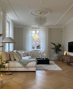 a living room filled with furniture and a christmas tree