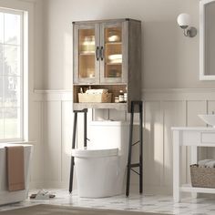 a white toilet sitting next to a bath tub in a bathroom under a window with wooden shelves above it