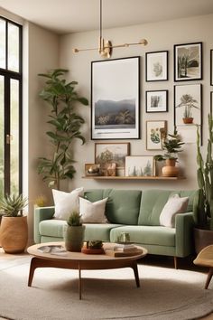 Modern living room with a green sofa, large plants, and a gallery wall of nature-themed artwork. Over Sofa Wall Decor Ideas Living Rooms, Wall Idea For Living Room, How To Decorate Wall With Photos, Living Room Designs Photo Wall, Living Room Art Arrangement, Ideas For A Wall In Living Room, Gallery Wall With Greenery, Blank Wall Next To Tv, Home Decor Ideas White Walls