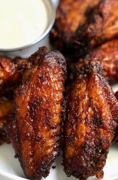 chicken wings with dipping sauce on the side