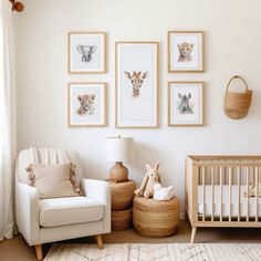 a baby's room with white walls and pictures on the wall