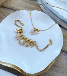 Embrace nature's beauty with this stunning gold-plated necklace and bracelet set, featuring delicate butterfly charms. This special design set brings elegance and charm to your everyday style, perfect for layering or wearing as a coordinated set. 🦋 Gold-plated butterfly charms for a graceful and nature-inspired touch ✨ Special design necklace and bracelet set, perfect for a coordinated look Crafted with high-quality gold plating for durability and lasting shine Ideal for gifting or as a stylish Delicate Butterfly, Necklace And Bracelet Set, Embrace Nature, Necklace And Bracelet, Themed Jewelry, Butterfly Charm, Design Set, Gold Plated Necklace, Special Design