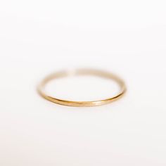 Womens 14k Solid Gold Wedding Band This Womens 14k Gold Hammered Wedding Band is handmade and made-to-order. It is a simple, yet elegant gold wedding band. It carries with it the classic 14k solid gold, while possessing a handmade and rustic character. https://etsy.com/shop/hephaestusRings Classic Yellow Gold Bands With Simple Design, Wedding Band With Smooth Bezel, 14k Gold Bands With Simple Design For Anniversary, Classic 14k Gold Stackable Rings With Simple Design, Dainty Hammered Stackable Wedding Rings, Minimalist 14k Gold Band With Smooth Bezel, Everyday 14k Gold Bands With Simple Design, Dainty Gold Wedding Ring With Simple Design, Everyday Simple 14k Gold Bands