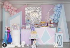 a frozen princess themed birthday party with balloons and desserts on the table, along with decorations