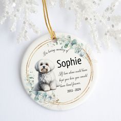 a ceramic ornament with a white dog on it