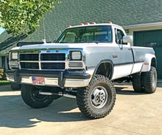 a large truck parked in front of a house