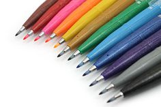 several different colored pencils lined up in a row