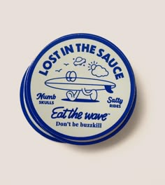 a blue and white button with the words lost in the sauce on it's side