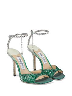 Saeda 100mm crystal-strap sandals These Saeda sandals are imbued with Jimmy Choo's glamorous flair. Sculpted from leather in a gradient design, they're covered with crystals and finished with a jeweled ankle strap, creating a captivating interplay of light. Made in Italy Highlights ~emerald green ~silver-tone ~calf leather ~gradient effect ~crystal embellishment ~crystal-embellished ankle strap ~square open toe ~branded leather insole ~high stiletto heel Jimmy Choo Saeda 100, Jimmy Choo Saeda, Green High Heels, Jimmy Choo Sandals, Crystal Sandals, Crystal Shoes, Satin Pumps, Embellished Sandals, Fabulous Shoes