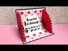 a handmade card with the words happy grand parents day written in black and red