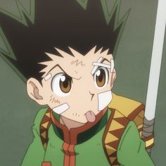 an anime character with black hair and brown eyes holding a white stick in his hand