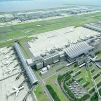 an aerial view of the airport and its surrounding area, with five stars above it