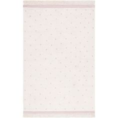 a white rug with pink dots on it