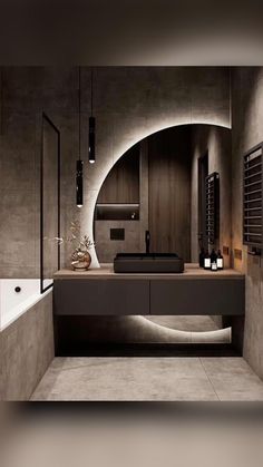 a modern bathroom with an oval mirror above the sink