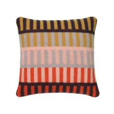 a multicolored striped pillow on a white background