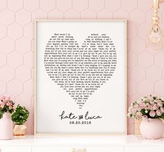 a heart shaped print with the words kate and lucas in black ink on a pink wall