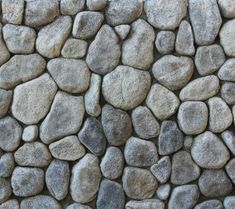 a stone wall made up of small rocks